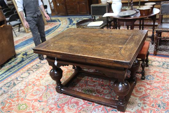 A mid 17th century Dutch oak draw leaf table extended 7ft 1.5in.